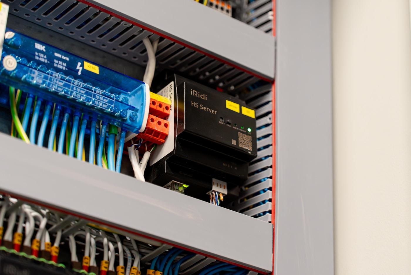 Connected electrical control panel with wiring and components.