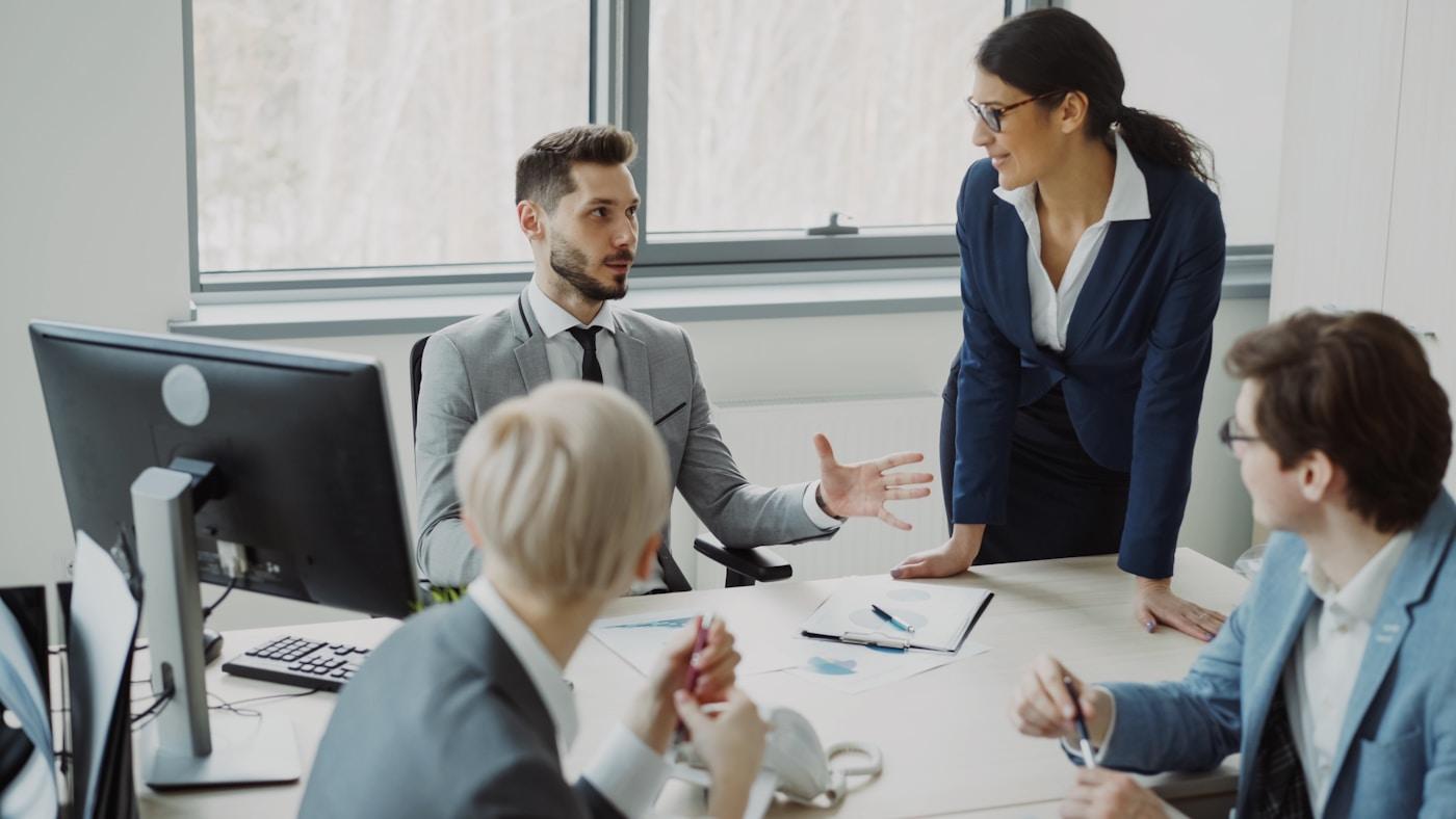 Professional team collaborating during an office meeting.