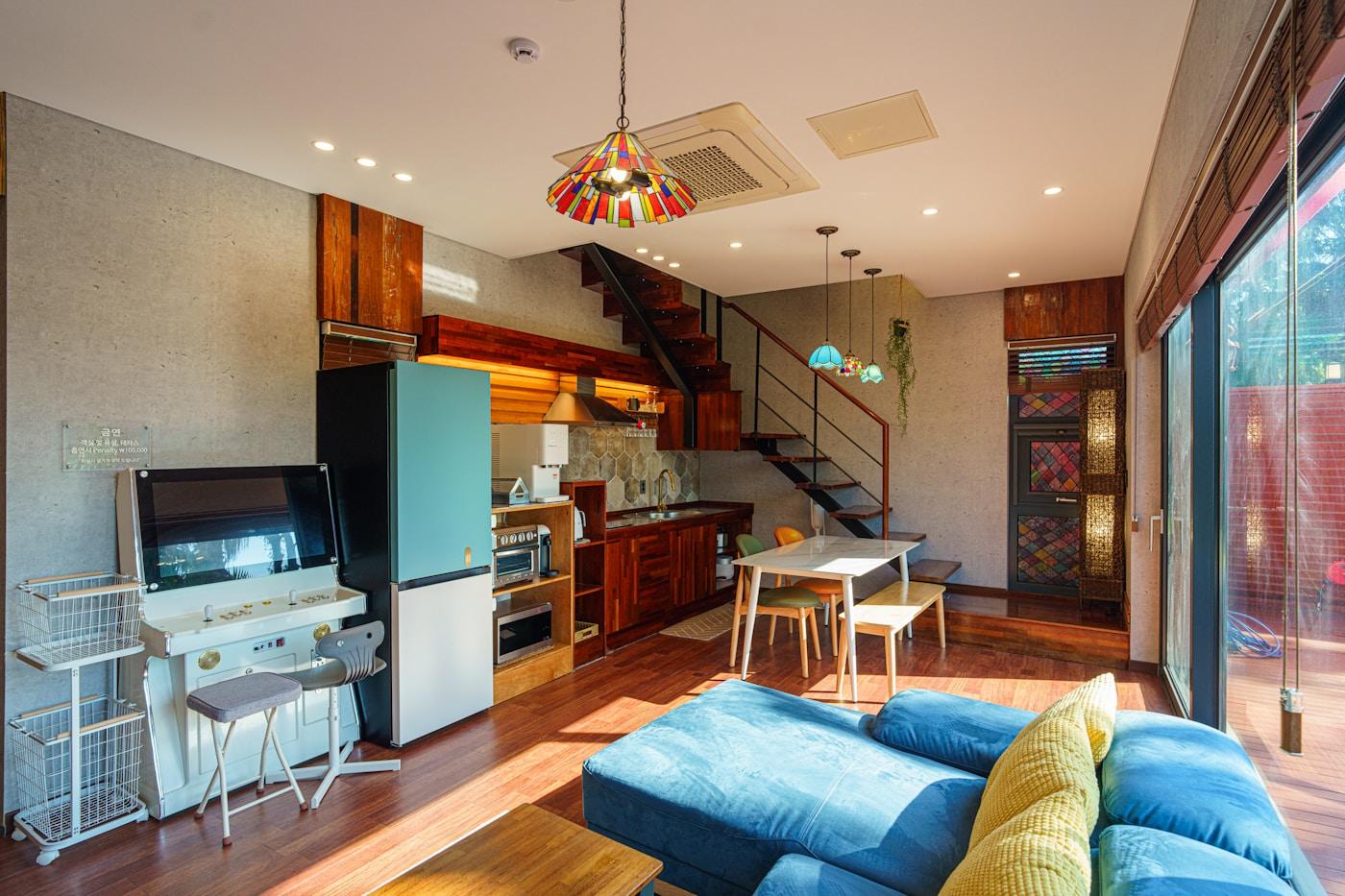 Modern apartment interior with connected living and kitchen areas.